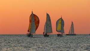 Sunsets and sailboats racing